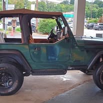Green Jeep Wrangler, side